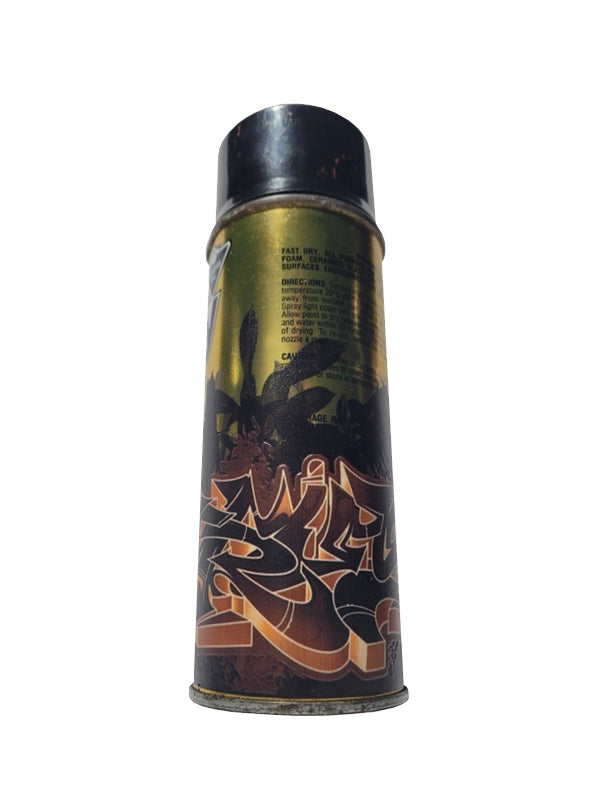 Vintage spray paint can with artistic design on a white background