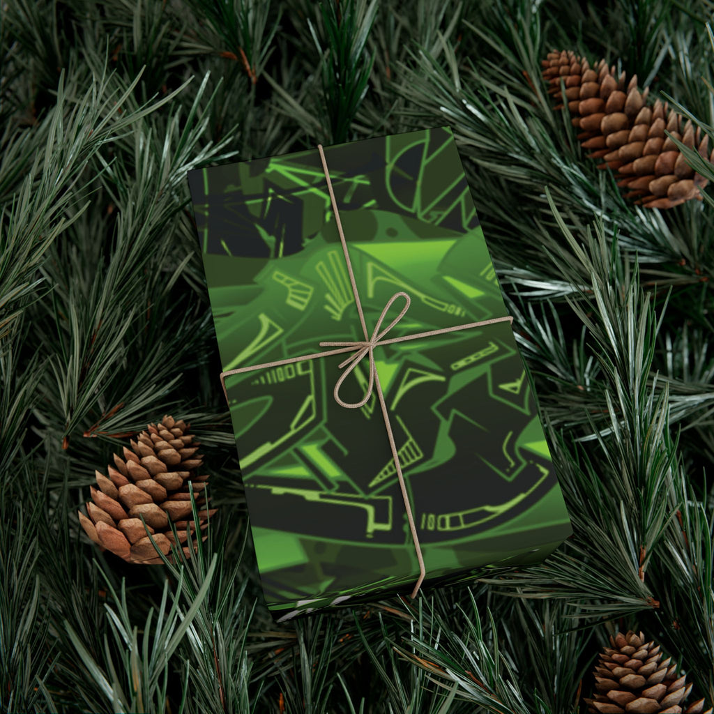 Green gift box with black designs on a bed of pine needles and pine cones