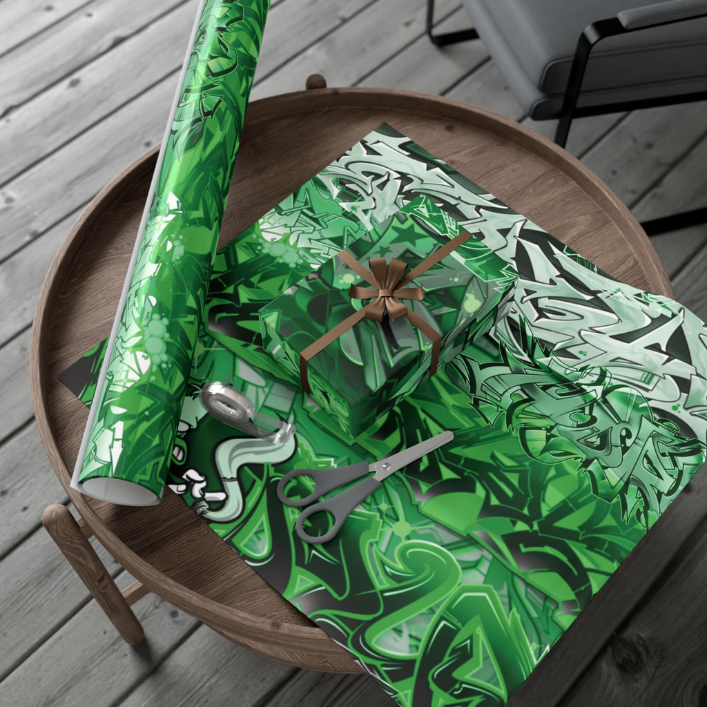 Green patterned gift wrap with scissors on a wooden table