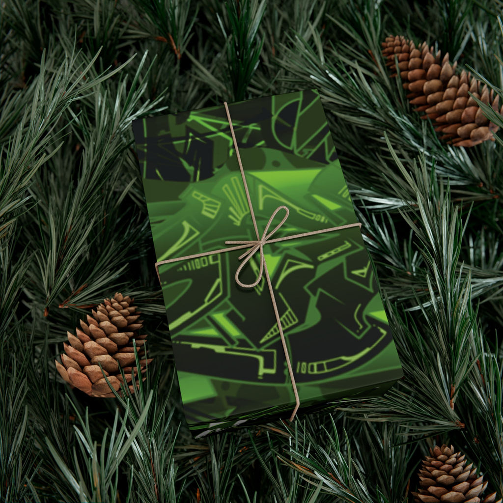 Green gift box with black patterns on a bed of pine needles and pine cones