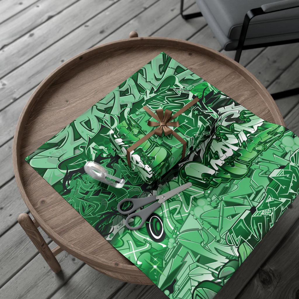Green patterned gift box with scissors on a wooden surface