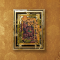 Decorative wall art with floral design and gold frame on a textured brown wall