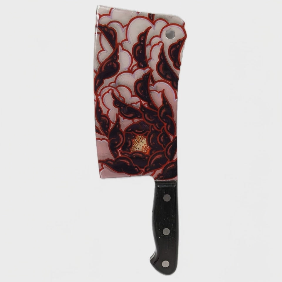 Hand-painted custom cleaver with red and black stylized peony motifs, created by Horus at Tuffytats Toronto.